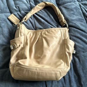Tan bucket bag by coach. Used but in great condition